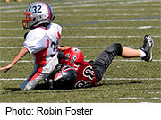 Boys who start playing tackle football before the age of 12 may face a higher risk for neurological deficits as adults