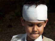 Children presenting with head injury with isolated vomiting rarely have clinically important traumatic brain injury or traumatic brain injury on computed tomography