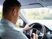 Inconsistent use of a child restraint system and negligent use of a seat belt are associated with parent/caregiver cellphone use while driving children