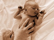 Maternal holding of newborns