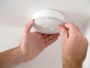 Audible Smoke Alarm More Effective With Increasing Child Age Man installing smoke detector