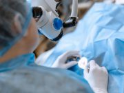 Providers, Patients Differ in Satisfaction With Anesthesia for Eye Surgery A professional ophthalmologist performs eye surgery with a microscope. The doctor inserted the dilator into the eye