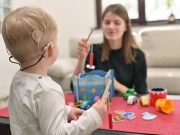 Cochlear Implants Beneficial for Deafness, Developmental Delays A Boy With Cochlear Implants Playing